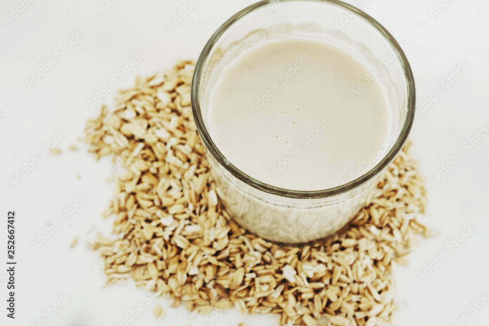 Plant milk. Oat grains milk on white background. Healthy food Plant milk. Oat grains milk on white background. Healthy food