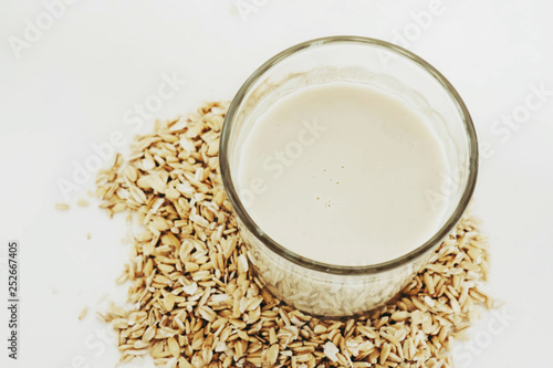 Plant milk. Oat grains milk on white background. Healthy food