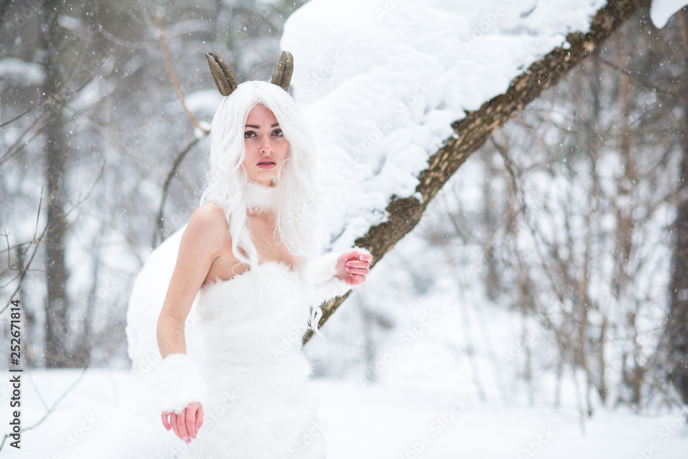 Cosplay girl in fantasy style in snow in winter Cosplay girl in fantasy style in snow in winter