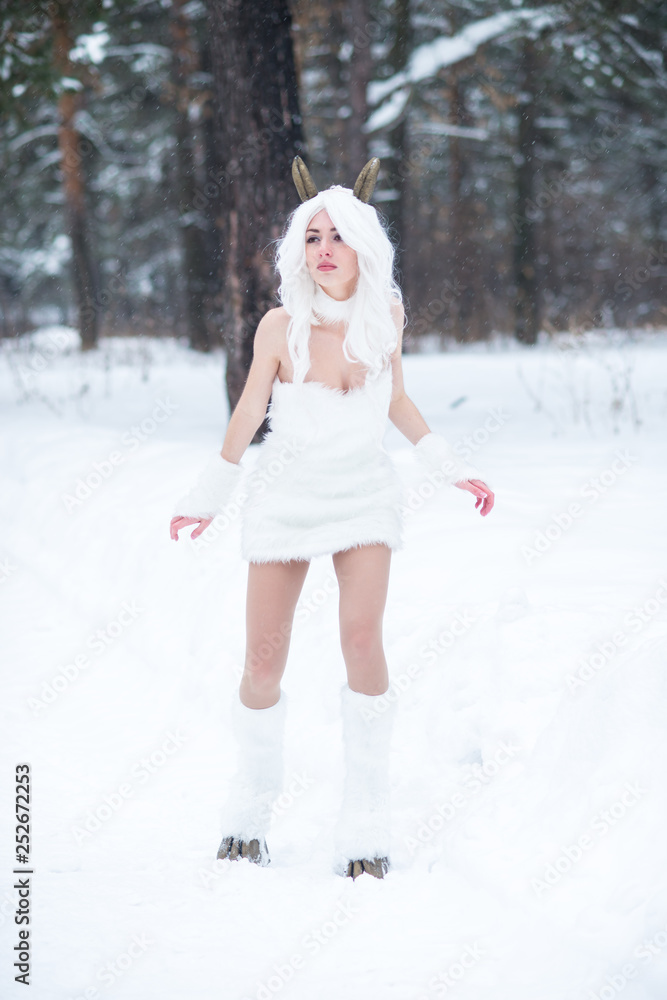 Cosplay girl in fantasy style in snow in winter Cosplay girl in fantasy style in snow in winter