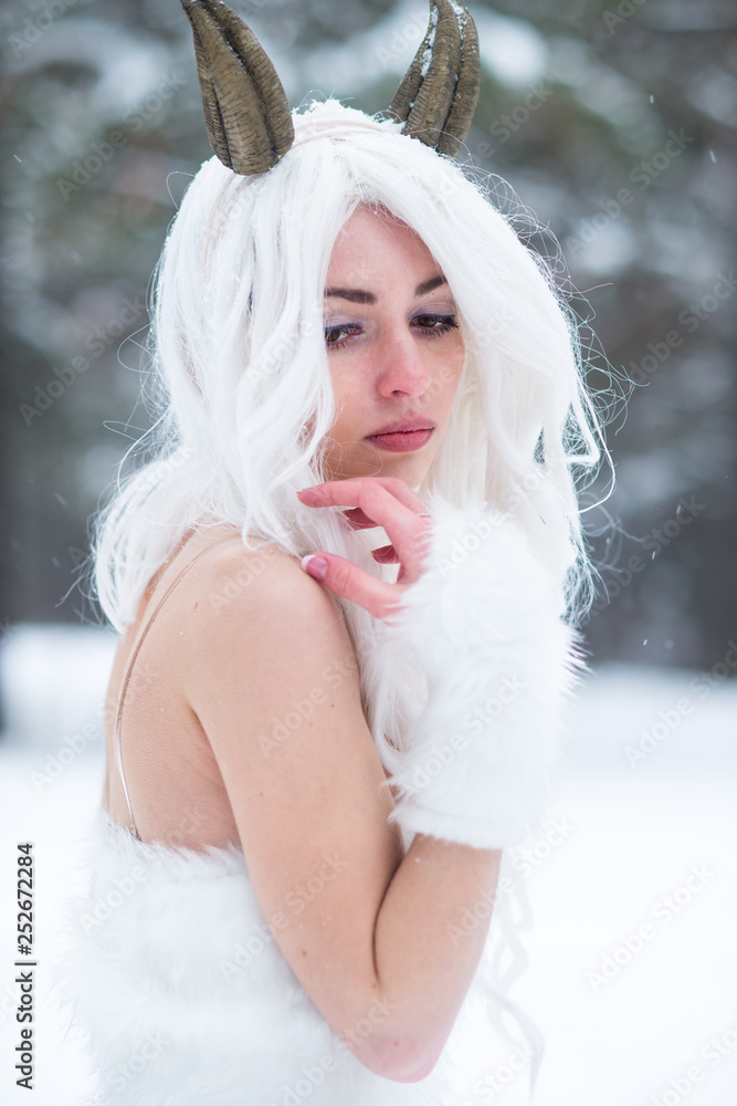 Cosplay girl in fantasy style in snow in winter Cosplay girl in fantasy style in snow in winter