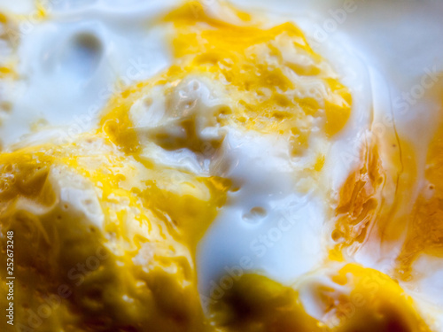 close up of cooked egg yellow and white yolk food