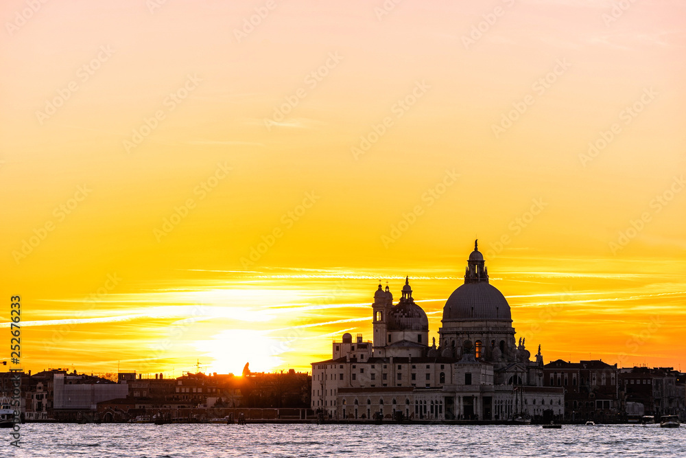 Colorful skyline of Venice, Italy at sunset. Beautiful sunet behind Basilica Santa Maria della Salut.