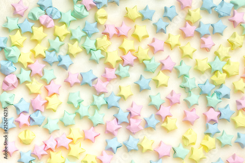 Beautiful background with light multi-colored paper stars