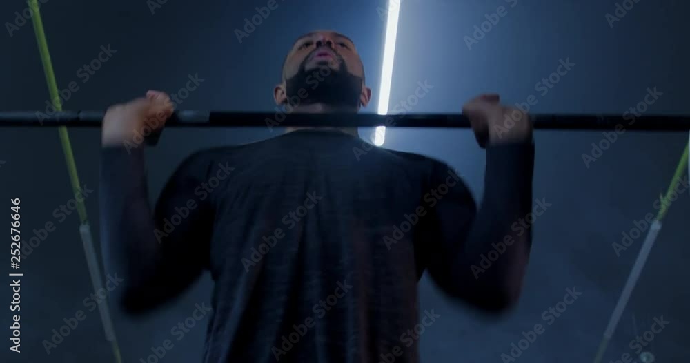 CU portrait of African American black male athlete training with barbell in a gym. Functional workout. 4K UHD CU portrait of African American black male athlete training with barbell in a gym. Functional workout. 4K UHD