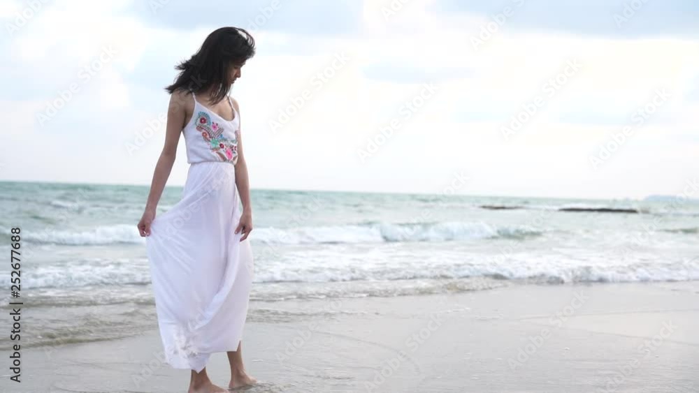 Asian cute girl relax on the beach . Relaxing concept. Asian cute girl relax on the beach . Relaxing concept.