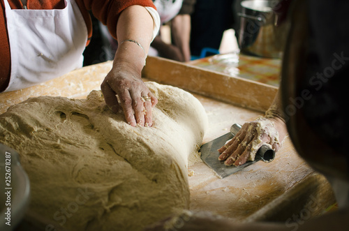 Women kneading bread