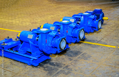 electric vacuum pumps are on the floor in the workshop photo