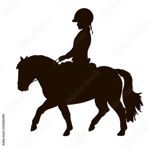 Silhouette of a young rider trotting on a small pony.
