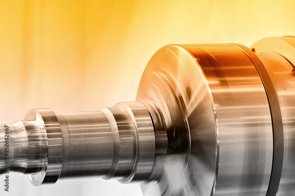 Rotating spindle of turning lathe. Red toned Rotating spindle of turning lathe. Red toned