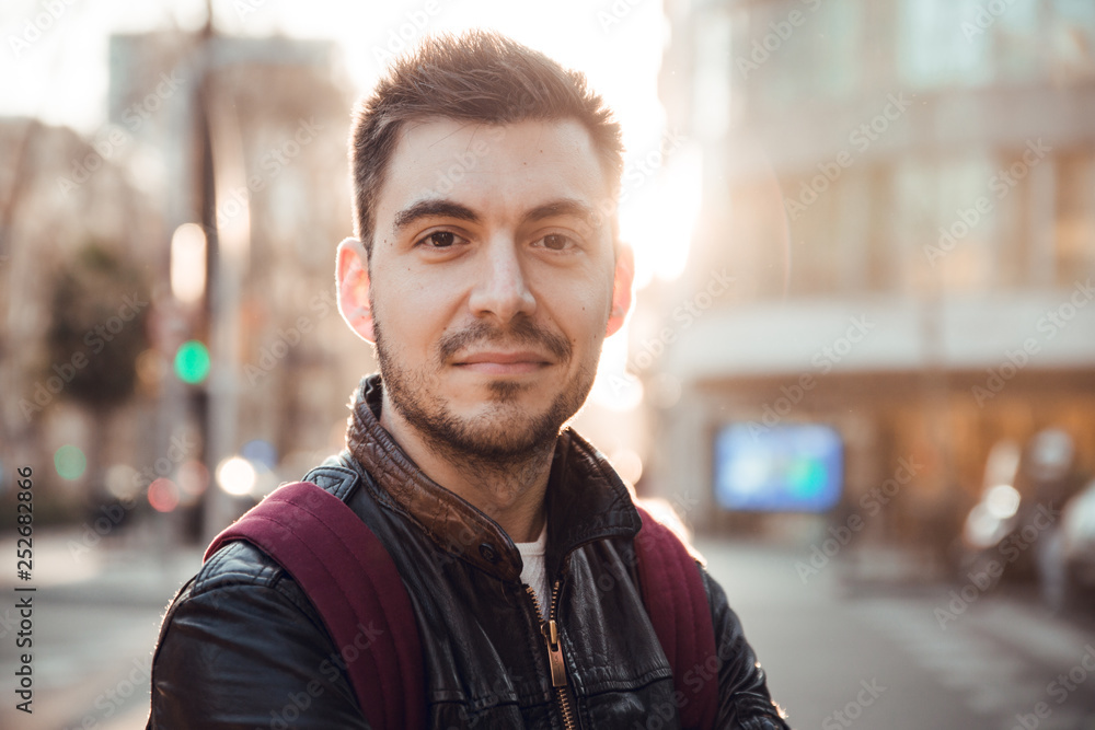 Close up of man with beard smiling at sunset in Barcelona city Close up of man with beard smiling at sunset in Barcelona city