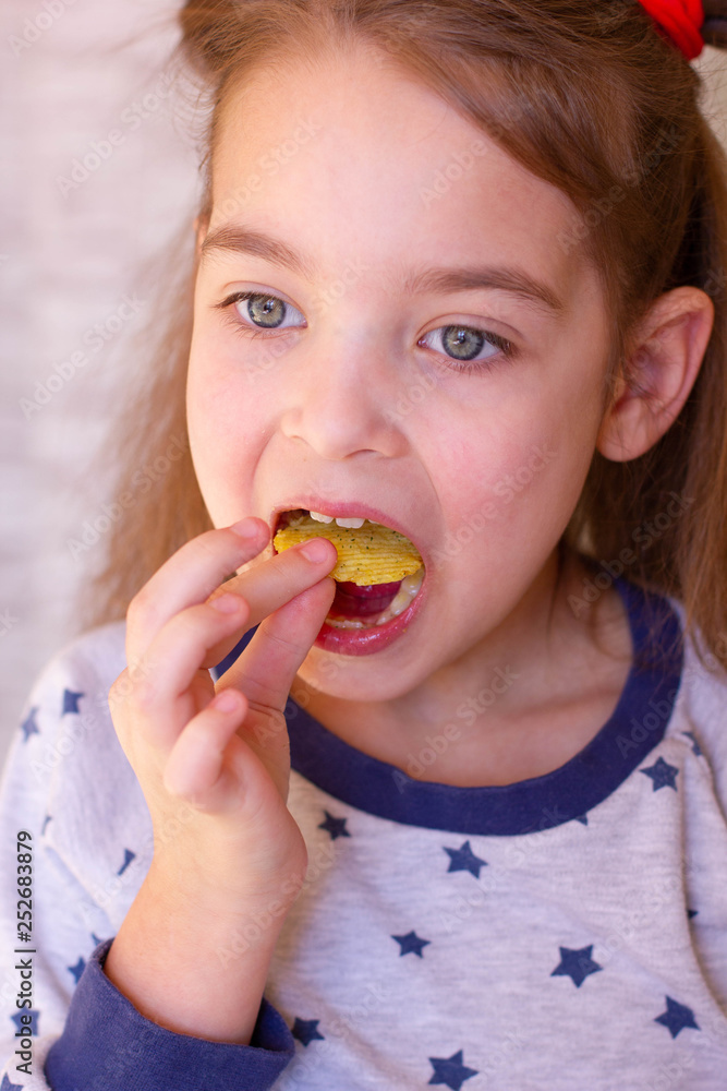 Baby eating chips.