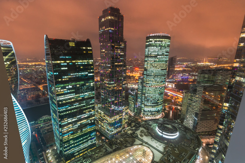 Aerial view of shopping and entertainment complex business complex Moscow City at night. Evening lights of Moscow International Business Center photo