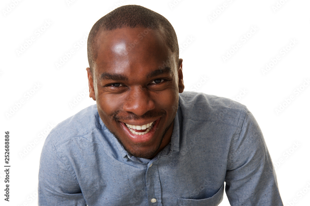 Obraz premium Close up laughing african american man against isolated white background
