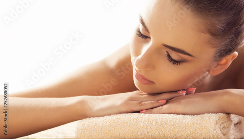 Close-up of young woman in spa. Traditional healing therapy and massaging treatments.