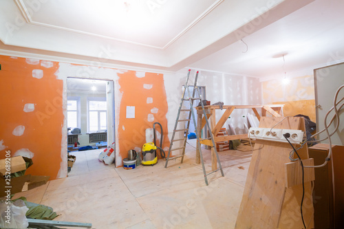 Canvas Print Working process of renovate room with installing drywall or gypsum plasterboard