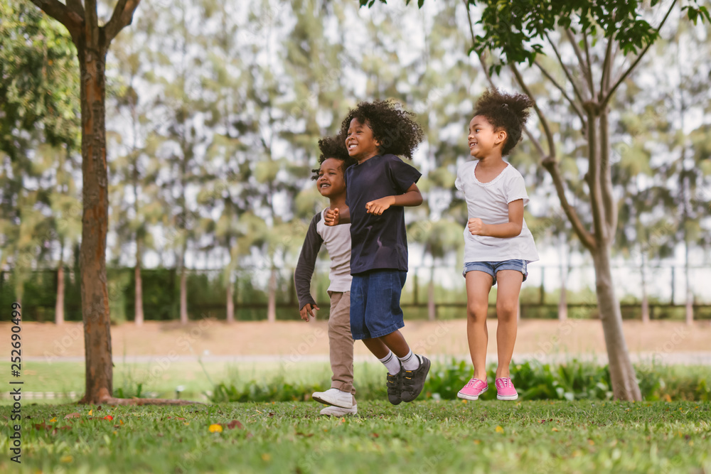 kids playing outdoors with friends. little children play at nature park. kids playing outdoors with friends. little children play at nature park.