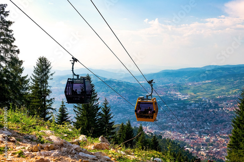View from the top of the mountain on the city of Sarajevo and funiculars rising up to the highest point of the city. Sarajevo, Bosnia and Herzegovina