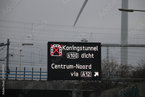 Dynamic route information panel warns for closed tunnel named Koningstunnel on S100 in The Hague on highway A4 photo