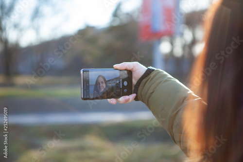 Kiev, Ukraine - March 01, 2019: Brand new Samsung Galaxy S10. Girl taking photo.