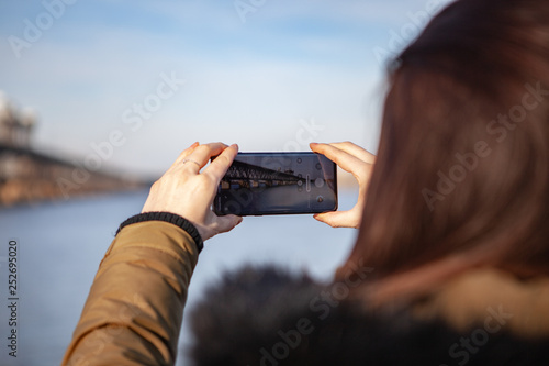 Kiev, Ukraine - March 01, 2019: Brand new Samsung Galaxy S10. Girl taking photo.