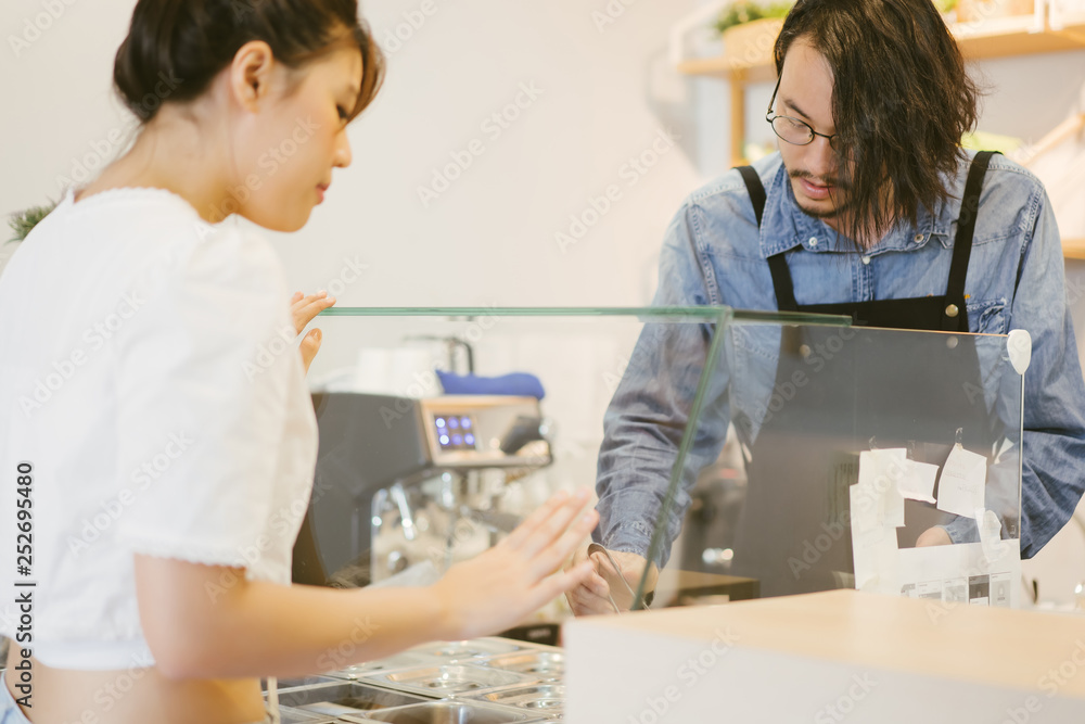 customer select and choose some food order to waiter at bar customer select and choose some food order to waiter at bar