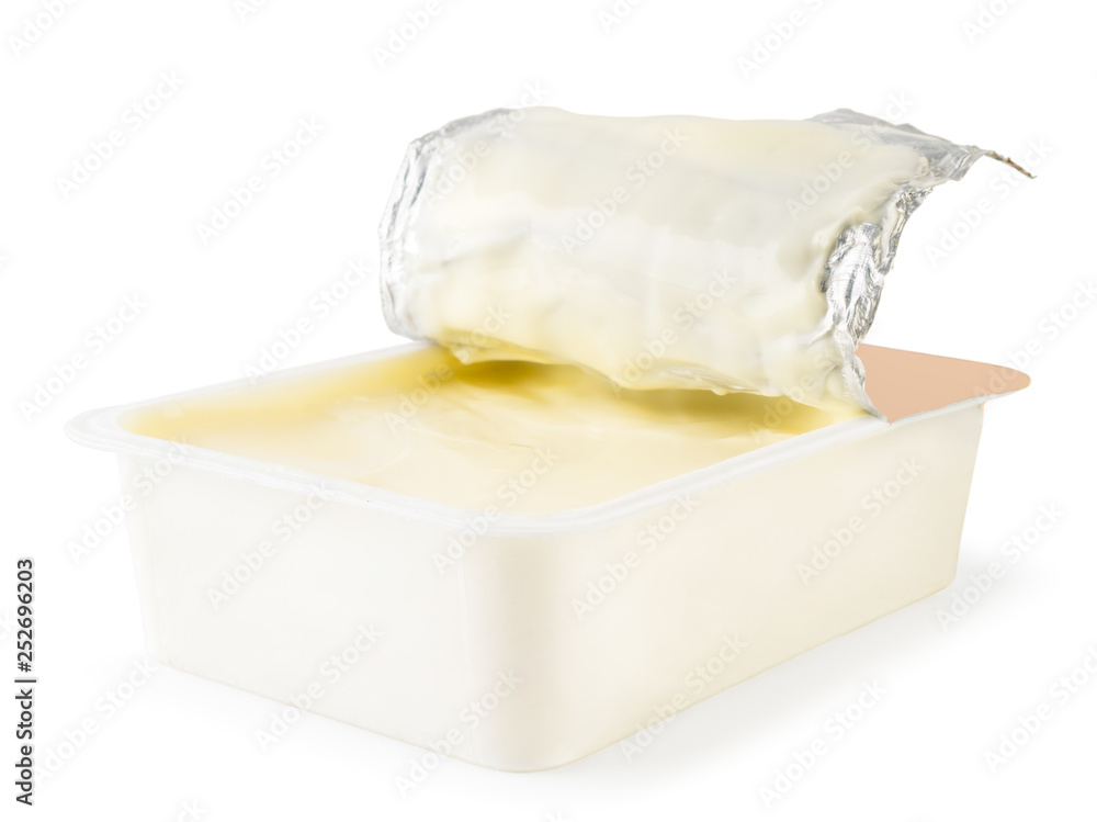 Processed cheese in a box close - up on a white. Isolated. Processed cheese in a box close - up on a white. Isolated.