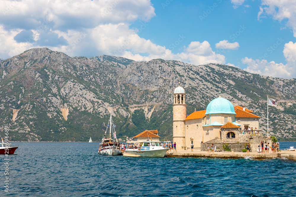 Amazing landscape view of the mountains, the sea, the island of the Virgin on the Reef  in Boka Kotorska Bay, Montenegro, August 2018