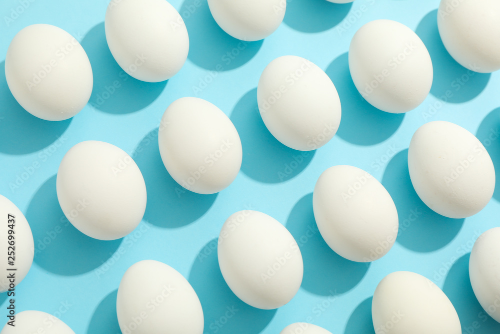 Flat lay composition with chicken eggs on color background, space for text Flat lay composition with chicken eggs on color background, space for text