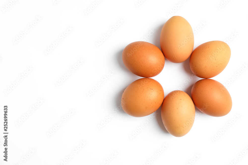 Flat lay composition with chicken eggs on color background, space for text Flat lay composition with chicken eggs on color background, space for text