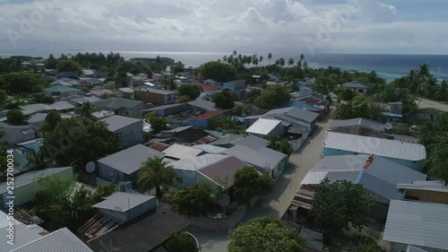  Аlight over houses on a small tropical island. Maldives.
