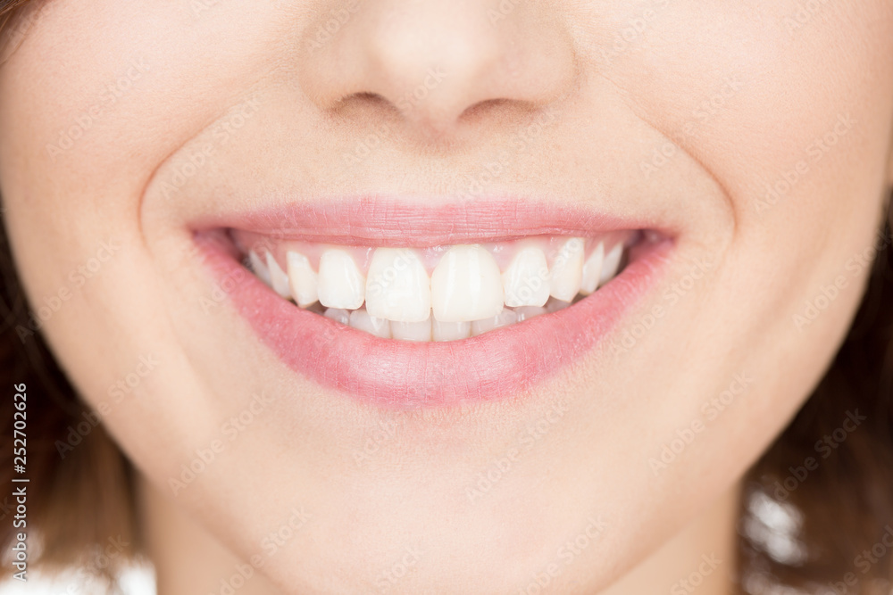 The smile. Cropped closeup of a beautiful pair of smiling lips The smile. Cropped closeup of a beautiful pair of smiling lips