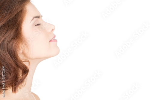 Relaxation leads to beauty. Horizontal closeup profile of a beautiful woman with her eyes closed