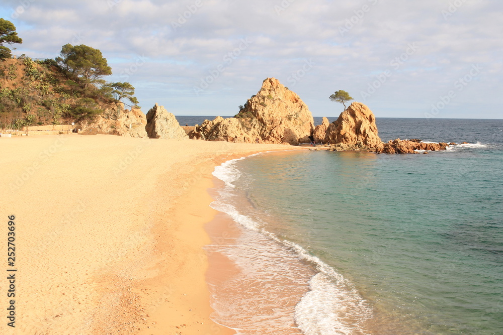Fototapeta premium Amazing beach of Tossa de mar, a Mediterranean coastal town in Catalonia, Spain. One of the most popular holiday resorts on the Costa Brava.