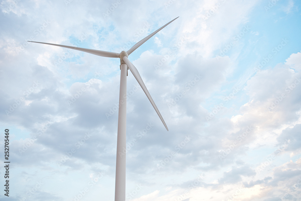 Row of wind power generators on blue sky background Row of wind power generators on blue sky background