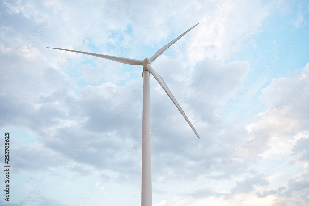 Row of wind power generators on blue sky background Row of wind power generators on blue sky background