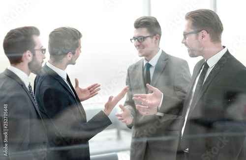 group of business people discussing common interests in the office