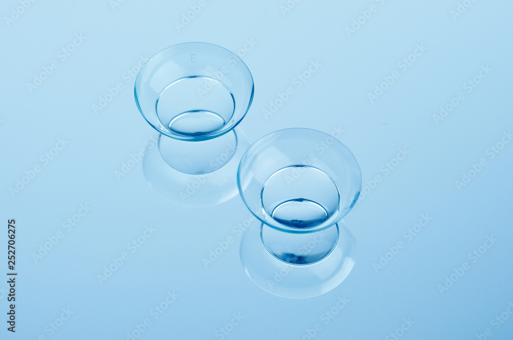 Contact lenses on blue background. Contact lenses on blue background.