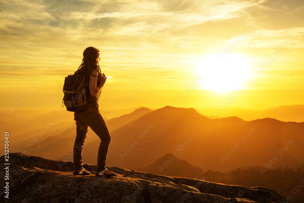 Hiker meets the sunset on the Moro rock in Sequoia national park, California, USA. Hiker meets the sunset on the Moro rock in Sequoia national park, California, USA.