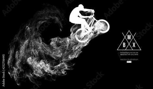 Abstract silhouette of a bmx rider on the dark, black background from particles, dust, smoke, steam. Bmx rider jumps and performs the trick. Background can be changed to any other. Vector illustration