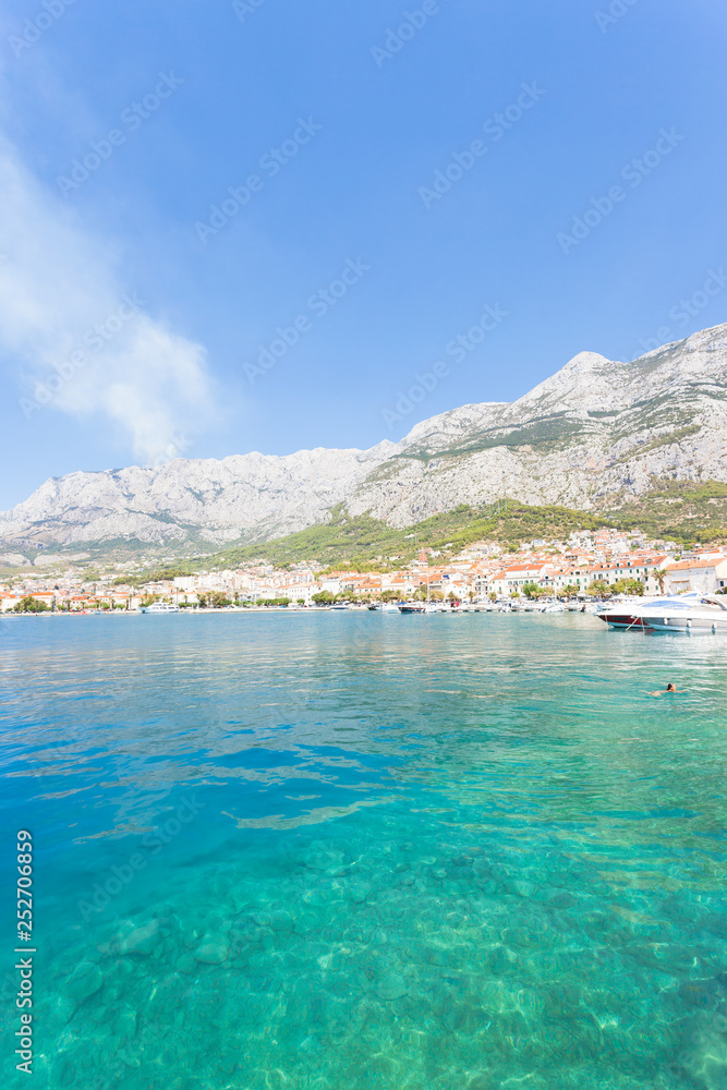 Makarska, Dalmatia, Croatia - A woman bathing at the bay of Makarska