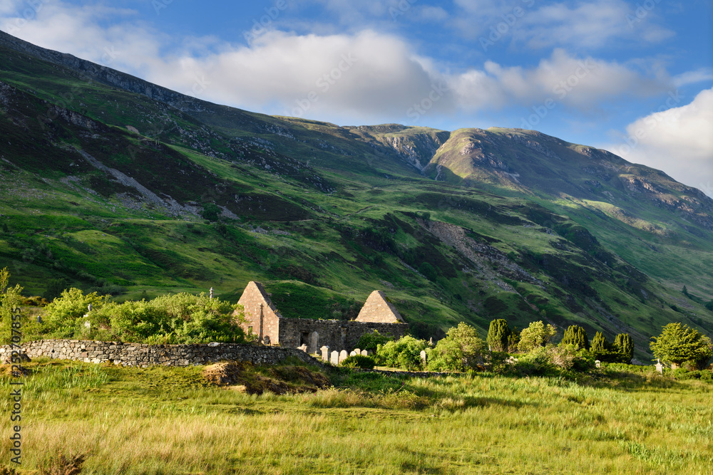 Ruins of St Dubhthach's Church next to Clachan Duich Burial Ground at head of Loch Duich under Beinn Bhreac peak in evening light Scotland Ruins of St Dubhthach's Church next to Clachan Duich Burial Ground at head of Loch Duich under Beinn Bhreac peak in evening light Scotland