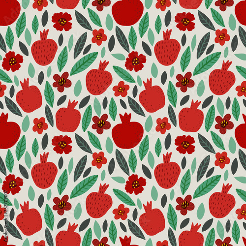 Seamless bright colorful floral pattern of pomegranates, flowers and leaves on white background. Perfect for textile, manufacturing, fabric etc. Vector illustration