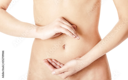 Women abdomen with hands making circle on white background.