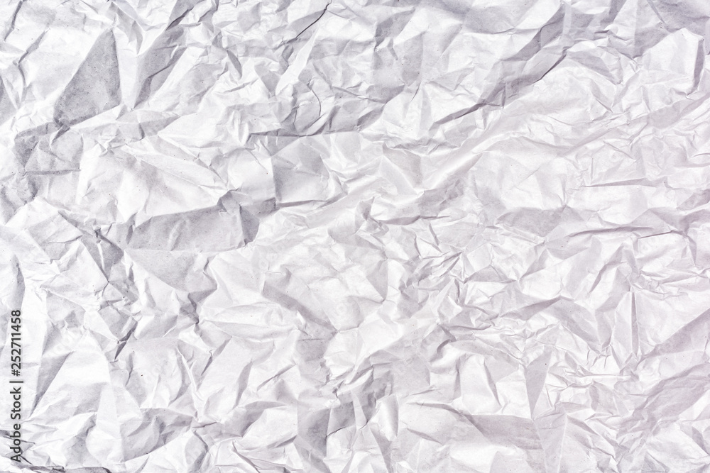 Texture of heavily crumpled gray paper. Empty background.