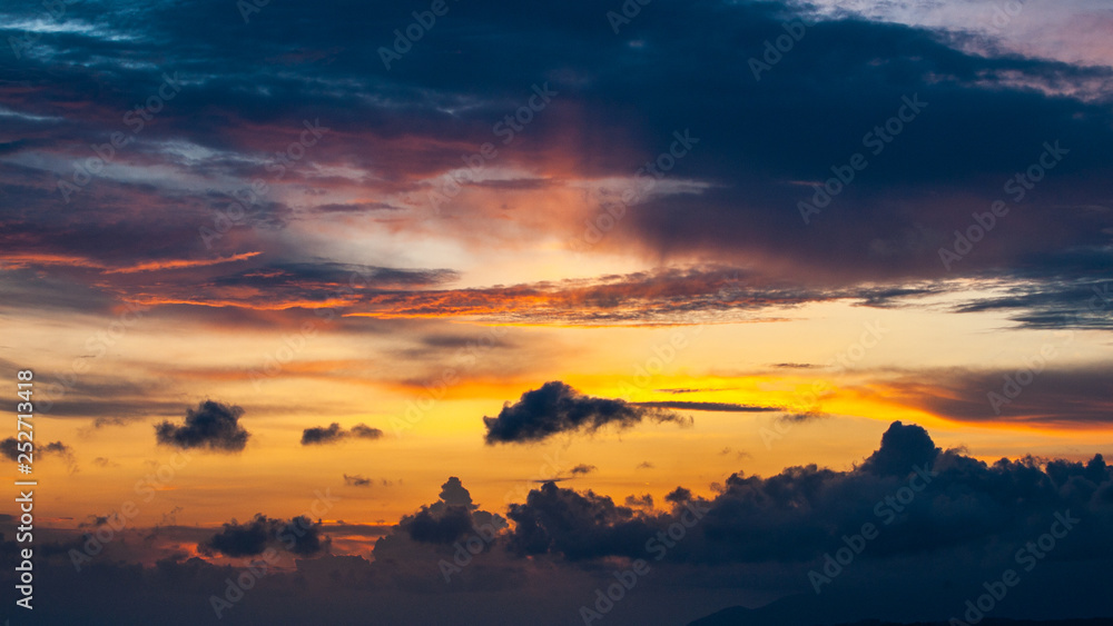 Dark dramatic clouds on evening sunset sky