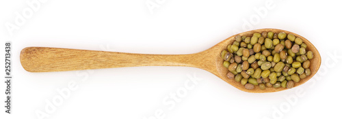 Mung beans in a wooden spoon isolated on white background. Top view