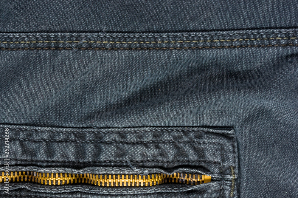 clothing items washed cotton fabric texture with seams, clasps, buttons and rivets clothing items washed cotton fabric texture with seams, clasps, buttons and rivets