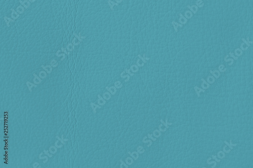 Texture of of genuine leather close-up, fashionable color, tender blue color. Modern background, copy space