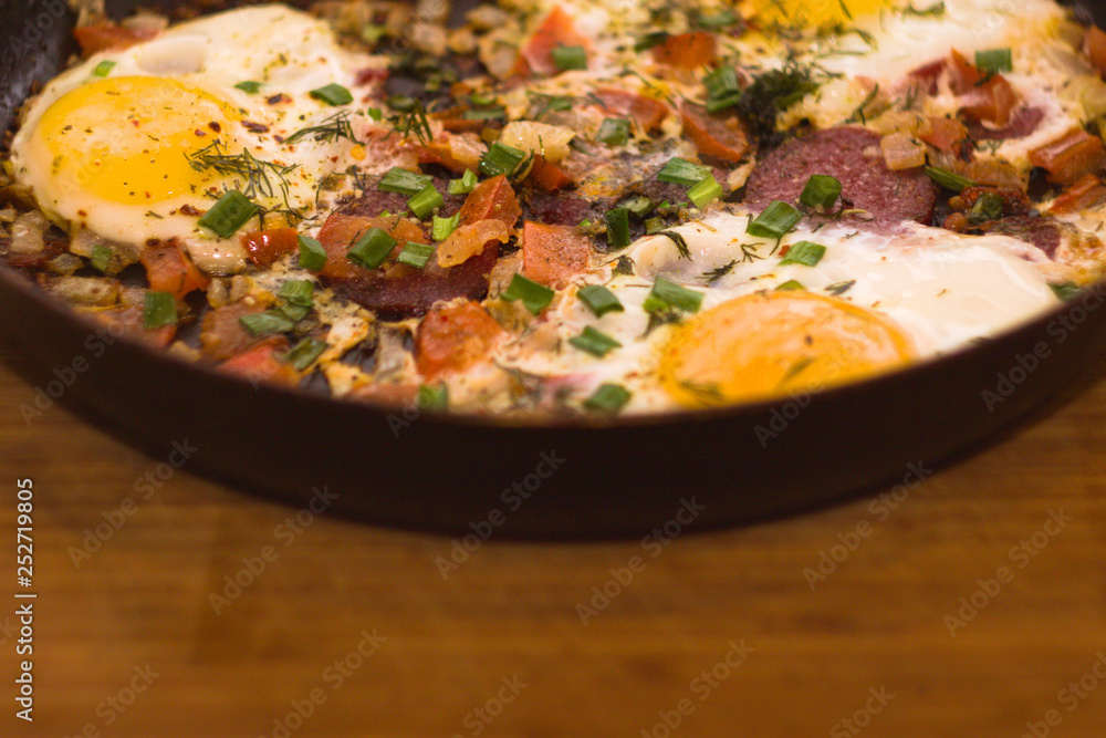 Scrambled eggs in a pan on a wood Board Scrambled eggs in a pan on a wood Board